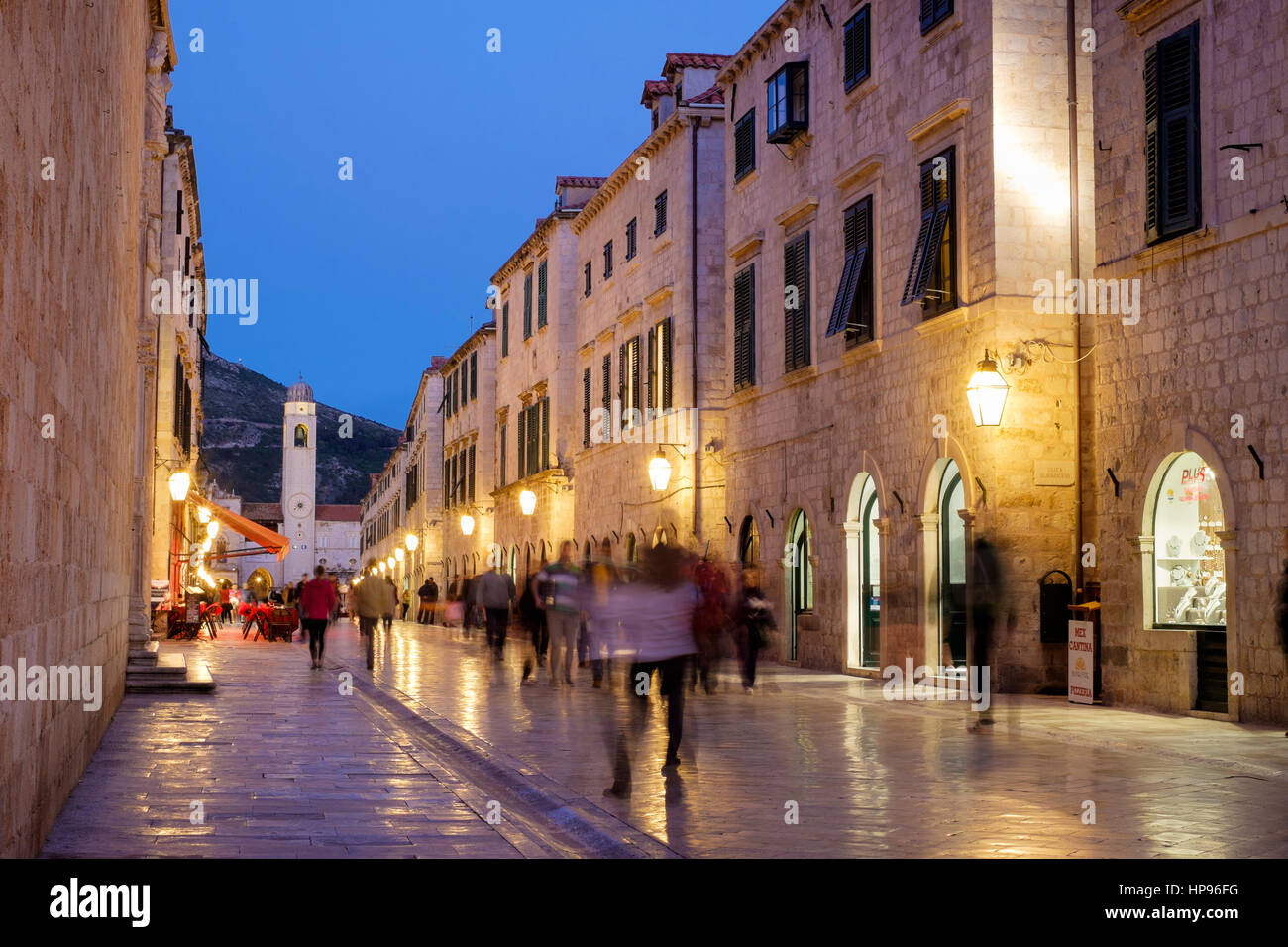 Tourists promenade along the Stradun (Placa) in the early evening, Dubrovnik, Croatia. Stock Photo