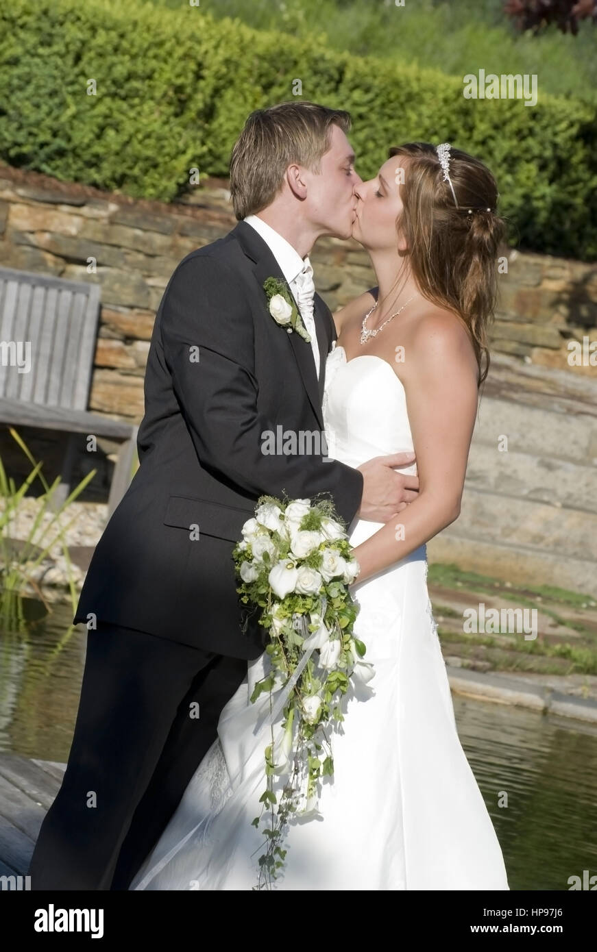 Newly married couple kissing in hi-res stock photography and images - Alamy