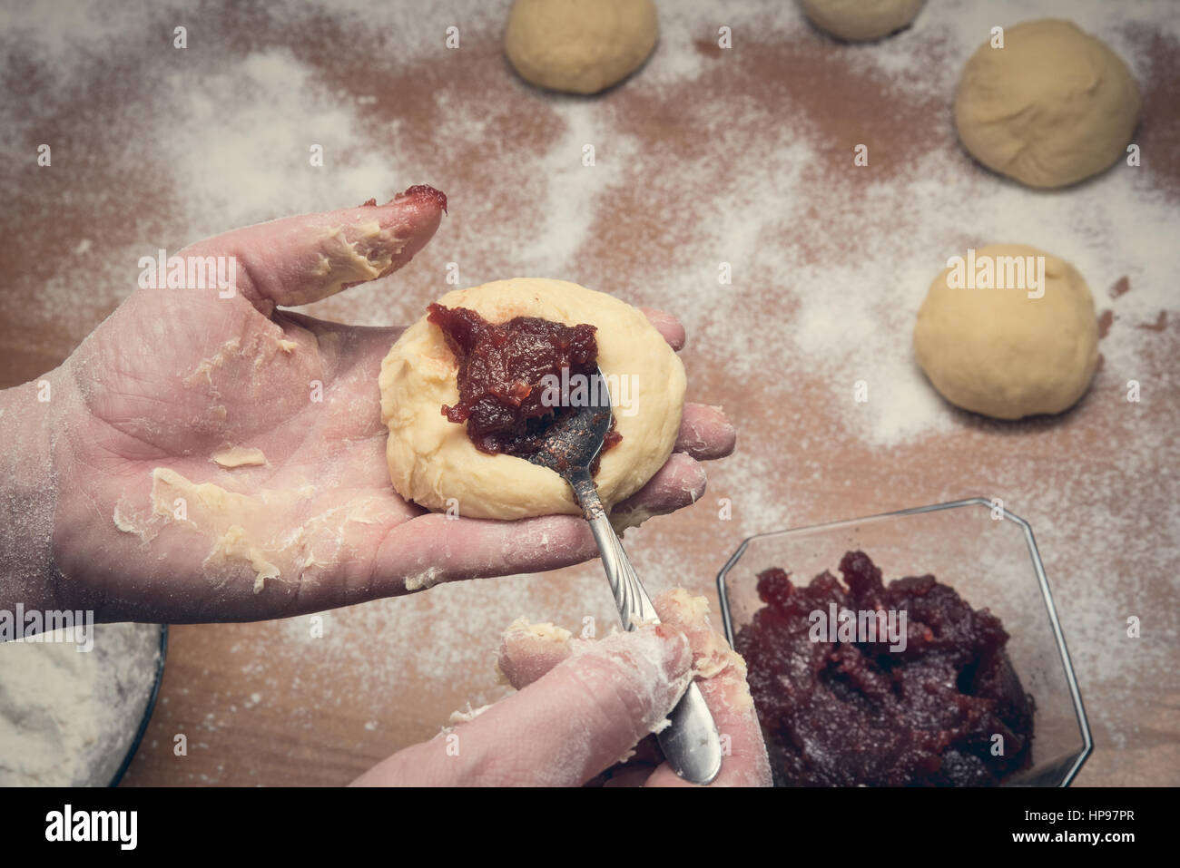 Woman's hands preparing home made doughnuts. Fat thursday concept Stock Photo
