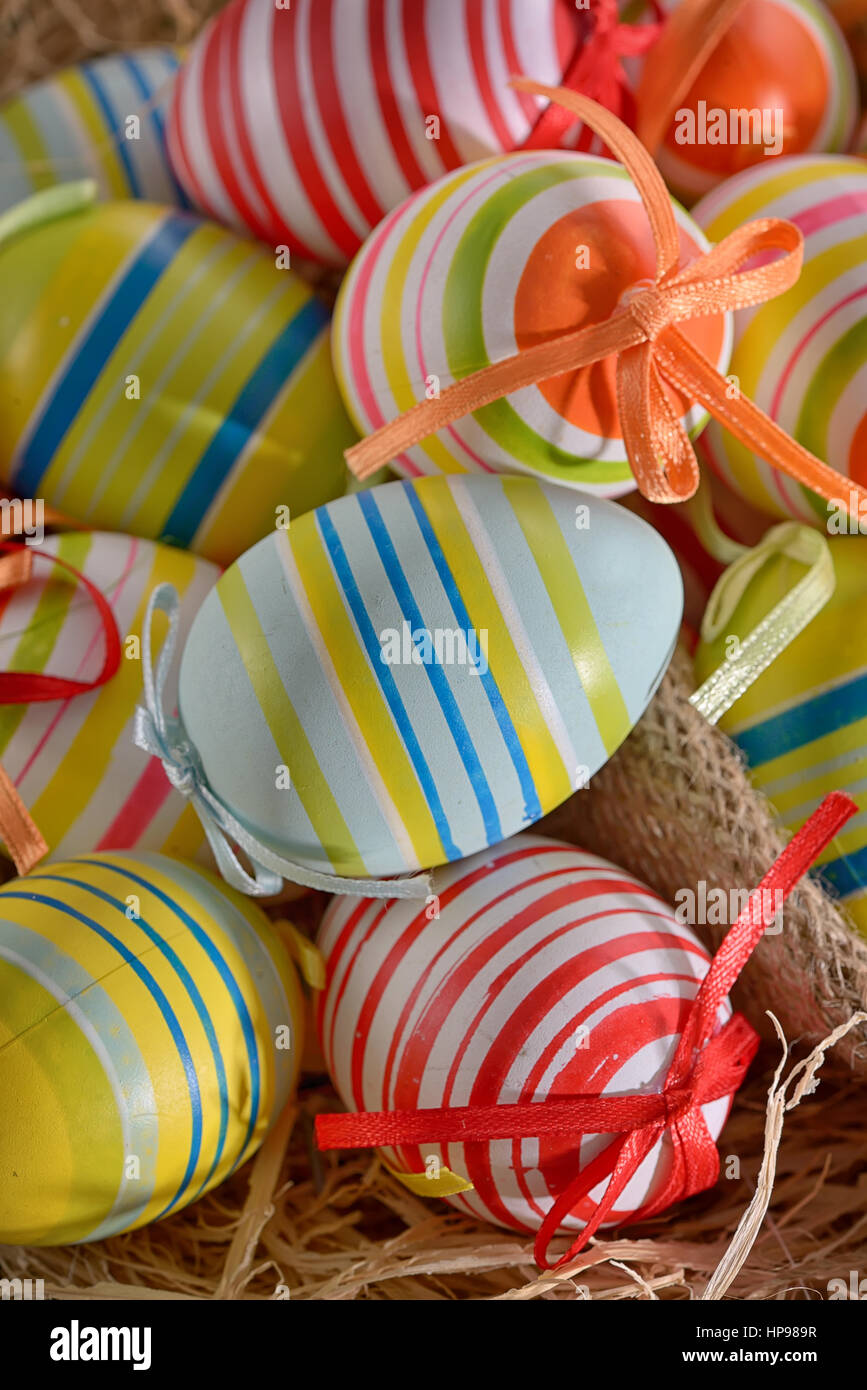 Colorful easter eggs isolated in basket Stock Photo - Alamy