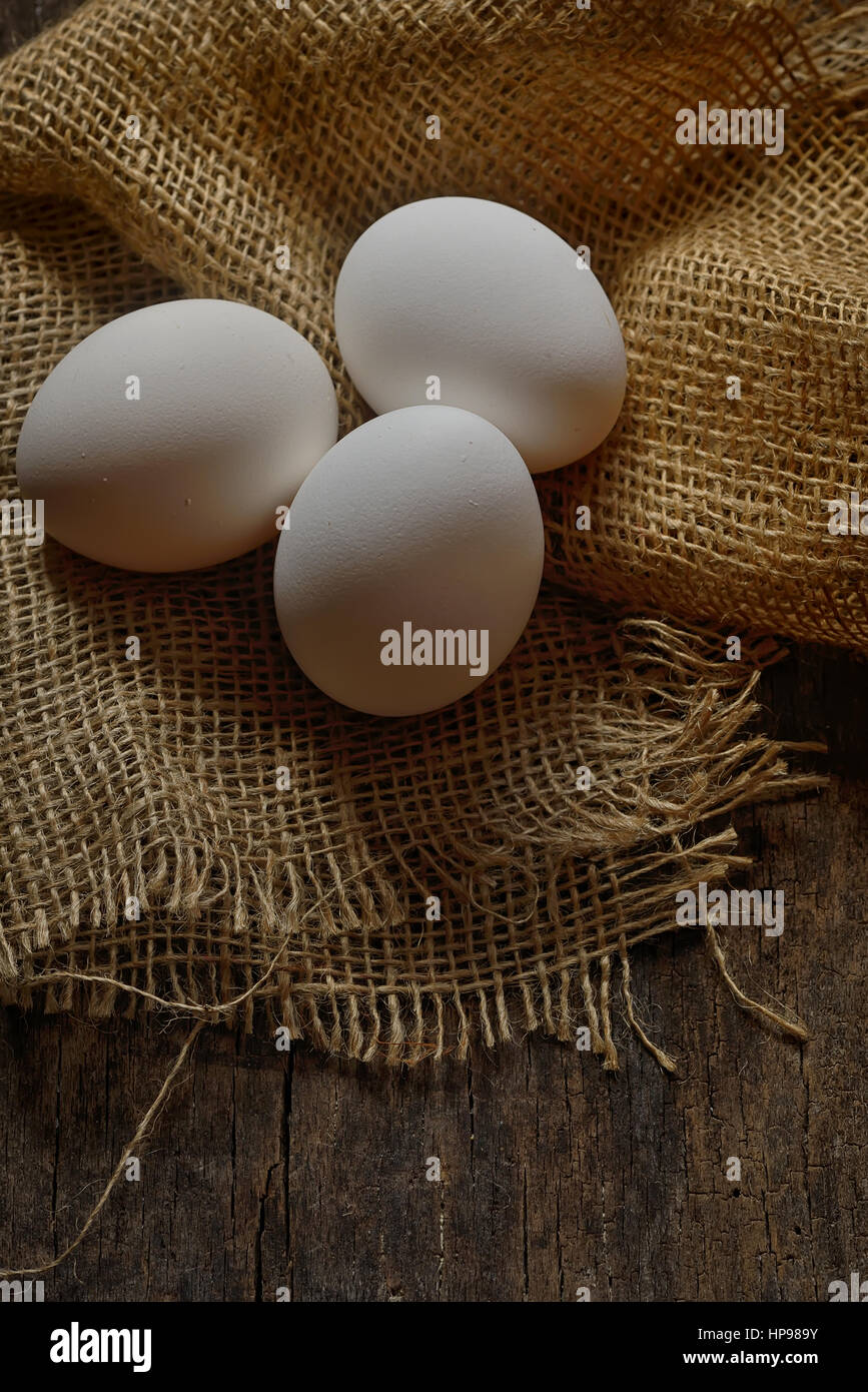 Fresh farm eggs on wooden background Stock Photo - Alamy
