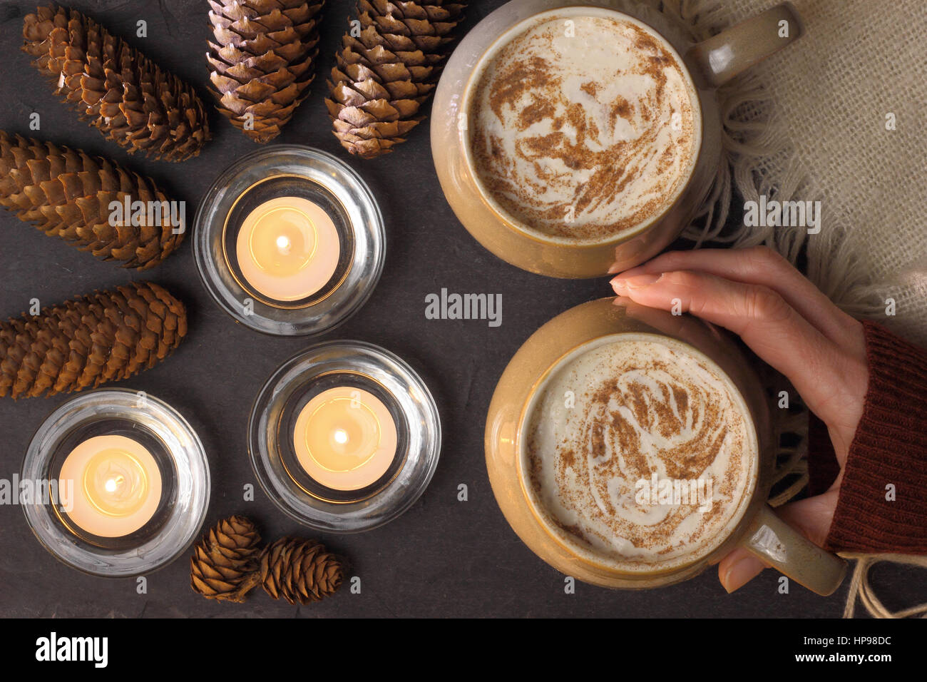 Mugs of creamy mocha (coffee and chocolate) served on slate in a cosy English home Stock Photo