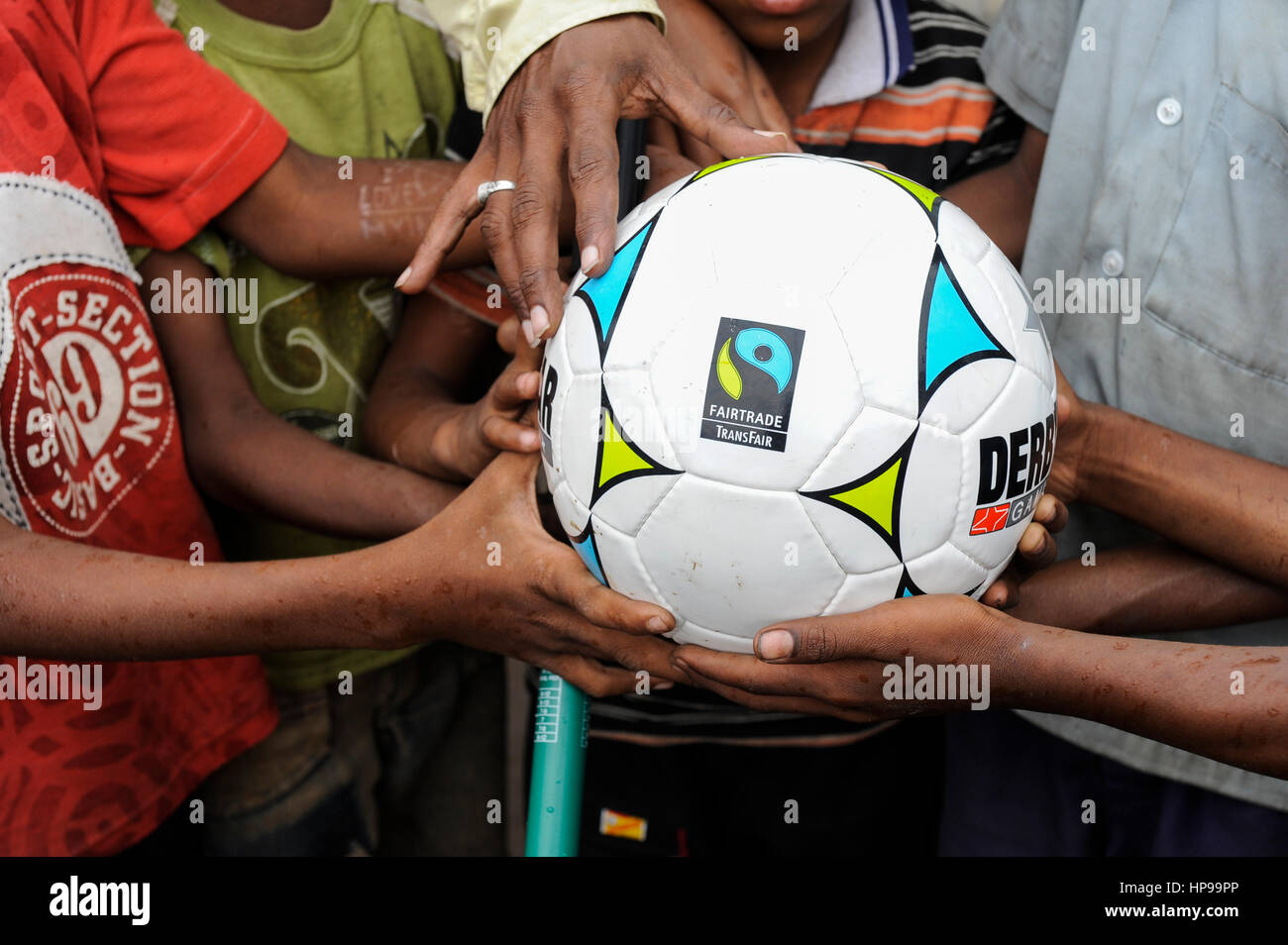 INDIA Odisha Orissa, Raygada, tribal village Malligoan, Dongria Kondh tribe, children hold a fairtrade soccer ball Stock Photo