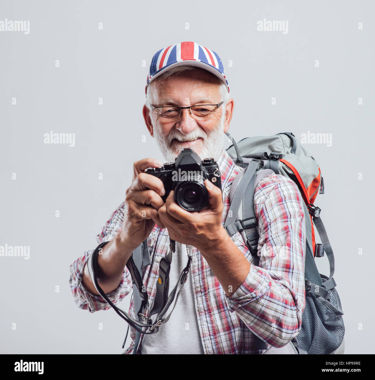 Senior Tourist Photographer With Backpack And Digital Camera - 