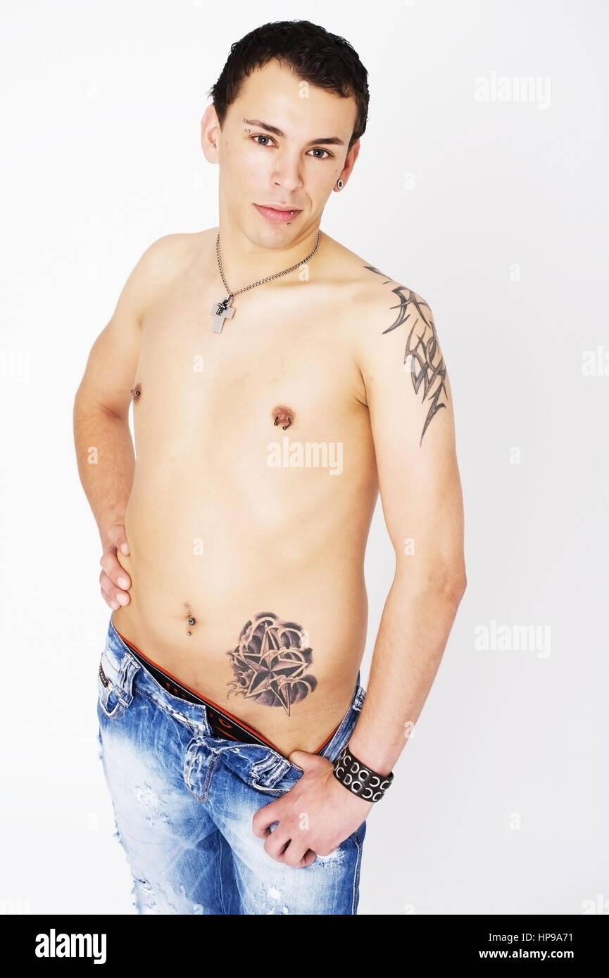 Model released , Junger Mann mit t?towiertem Oberkoerper - young man with tattoos Stock Photo