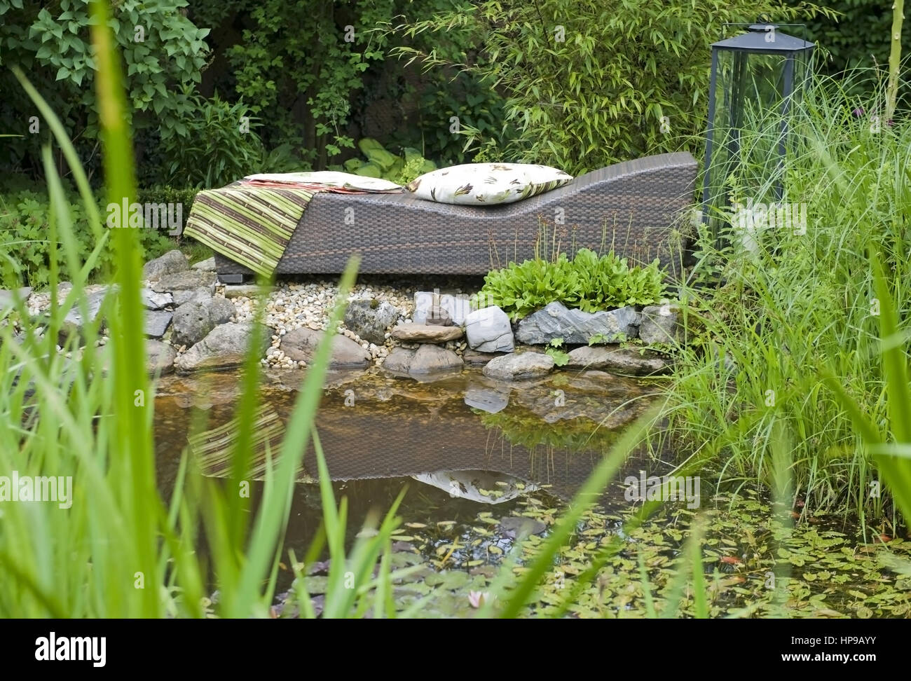 Liegestuhl am Gartenteich deckchair at garden pond Stock Photo Alamy