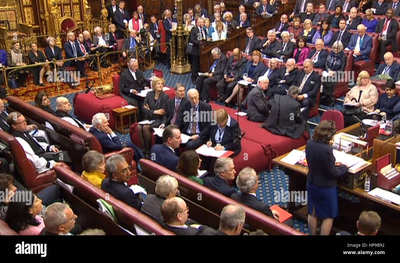 Prime Minister Theresa May sits behind the speaker (top left) as Baroness Williams of Trafford speaks in the House of Lords, London, during a debate on the Brexit Bill. Stock Photo