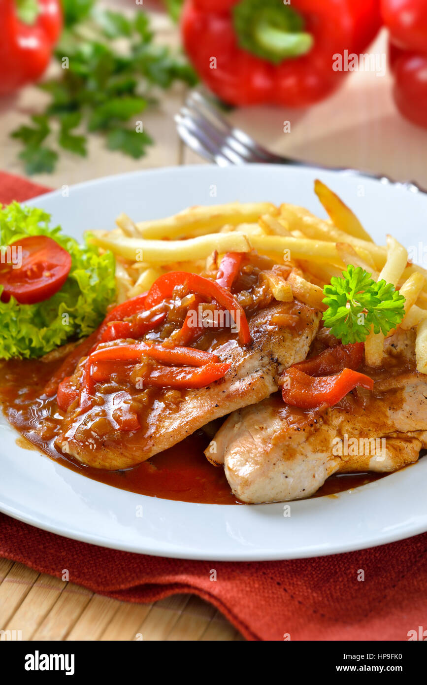 Hot escalope of turkey with red pepper sauce (socalled