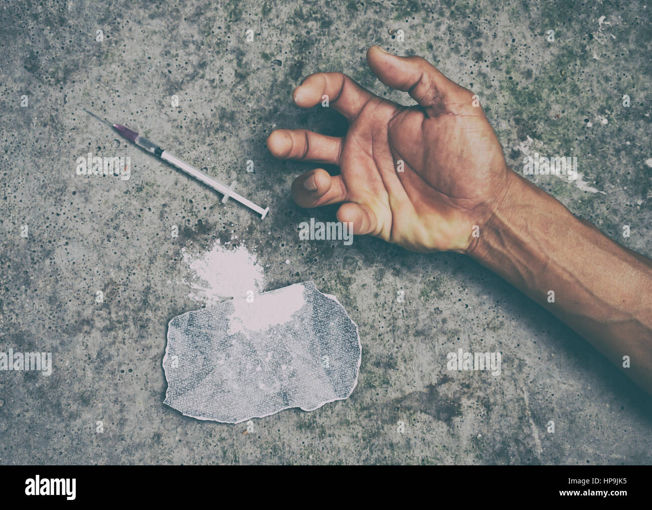 drug addict man with syringe in action Stock Photo