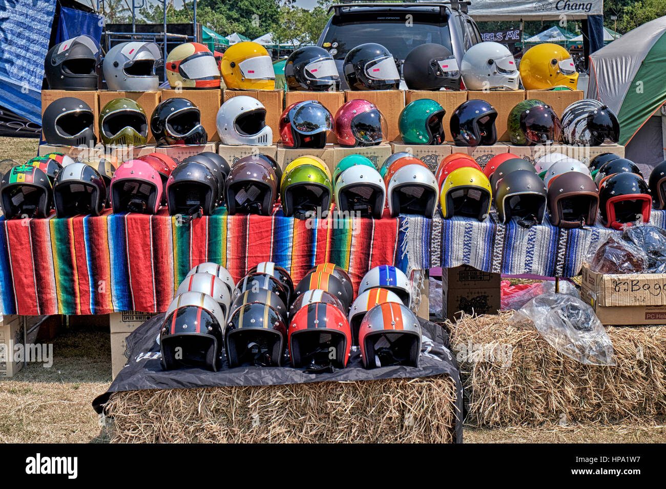 Assortment of Motorcycle safety helmets for sale at a biker festival