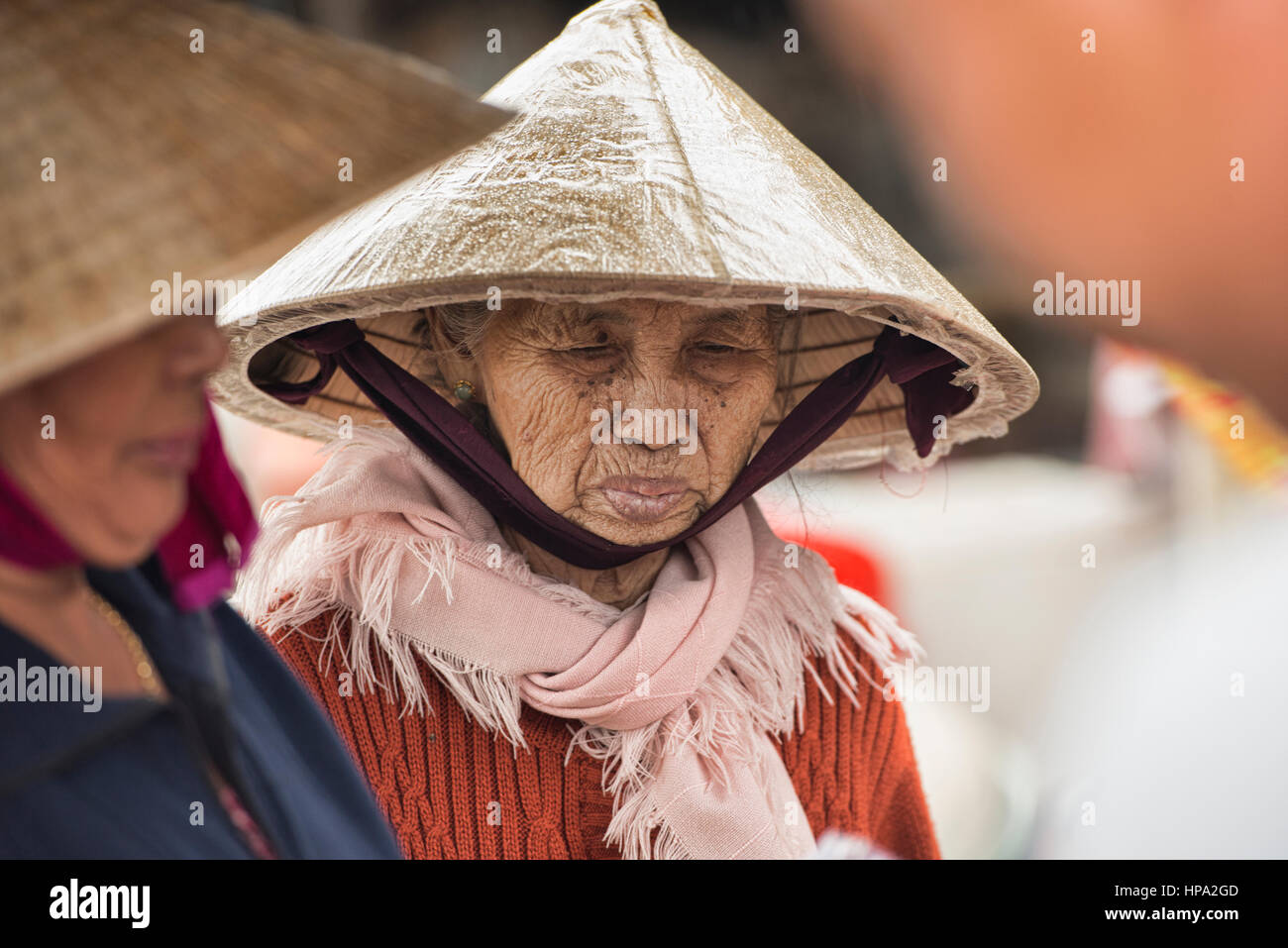 Portrait of an old vendor, Hoi An, Vietnam Stock Photo
