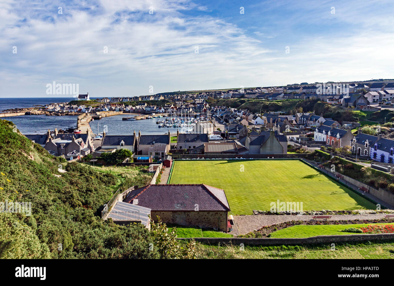 Findochty town and harbour area in Findochty Moray Scotland with bowling green in the foreground. Stock Photo