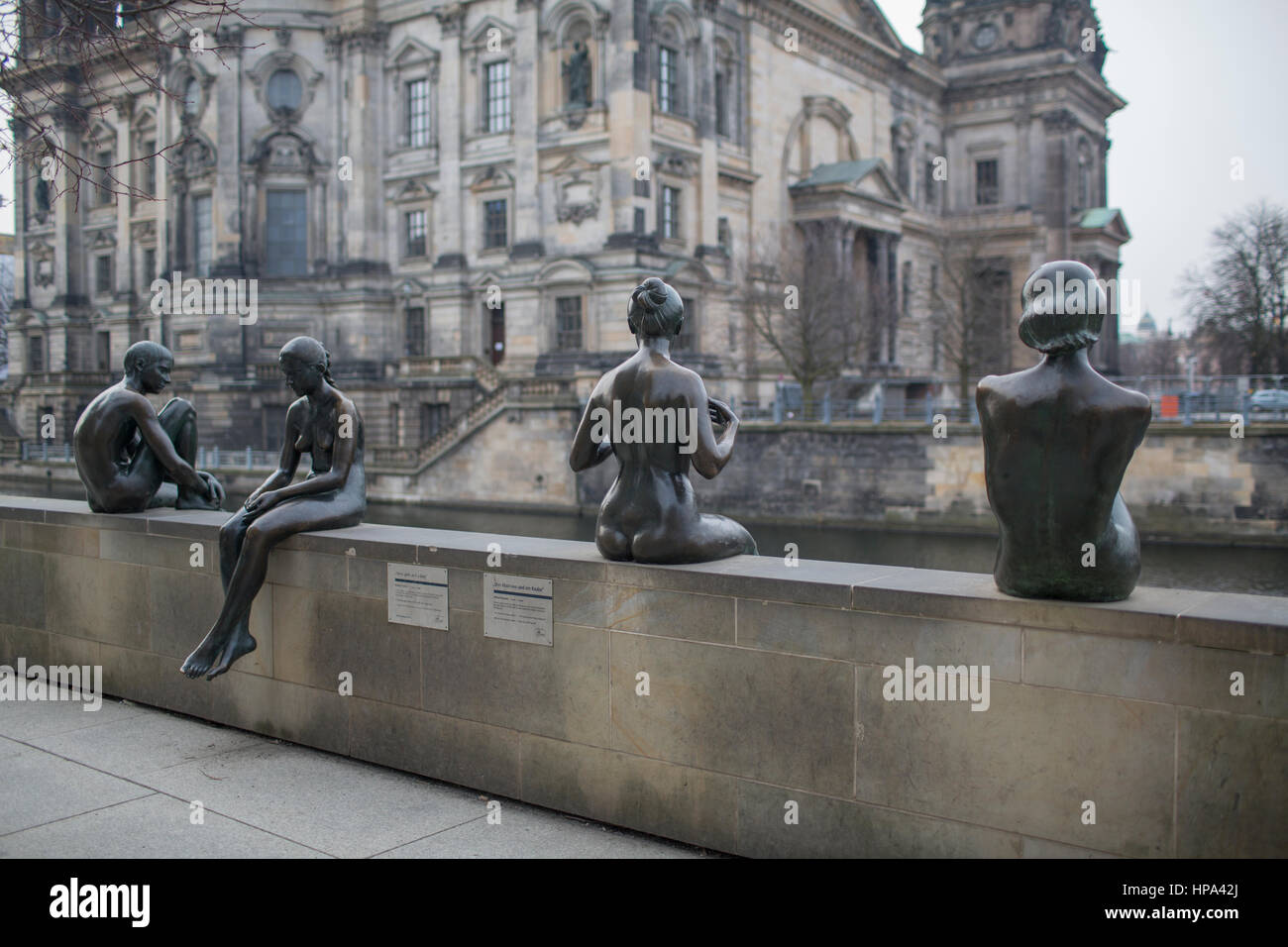 A group of bronze statues titled "Three Girls And A Boy" sited along