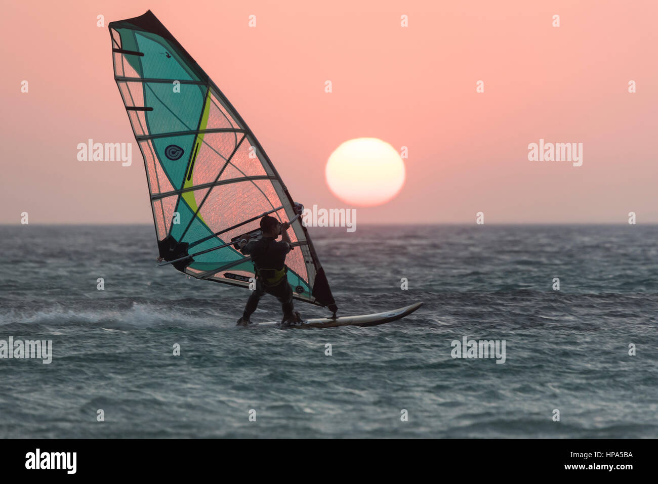 Windsurfing at sunset. Tarifa, Costa de la Luz, Cadiz, Andalusia, Spain. Stock Photo