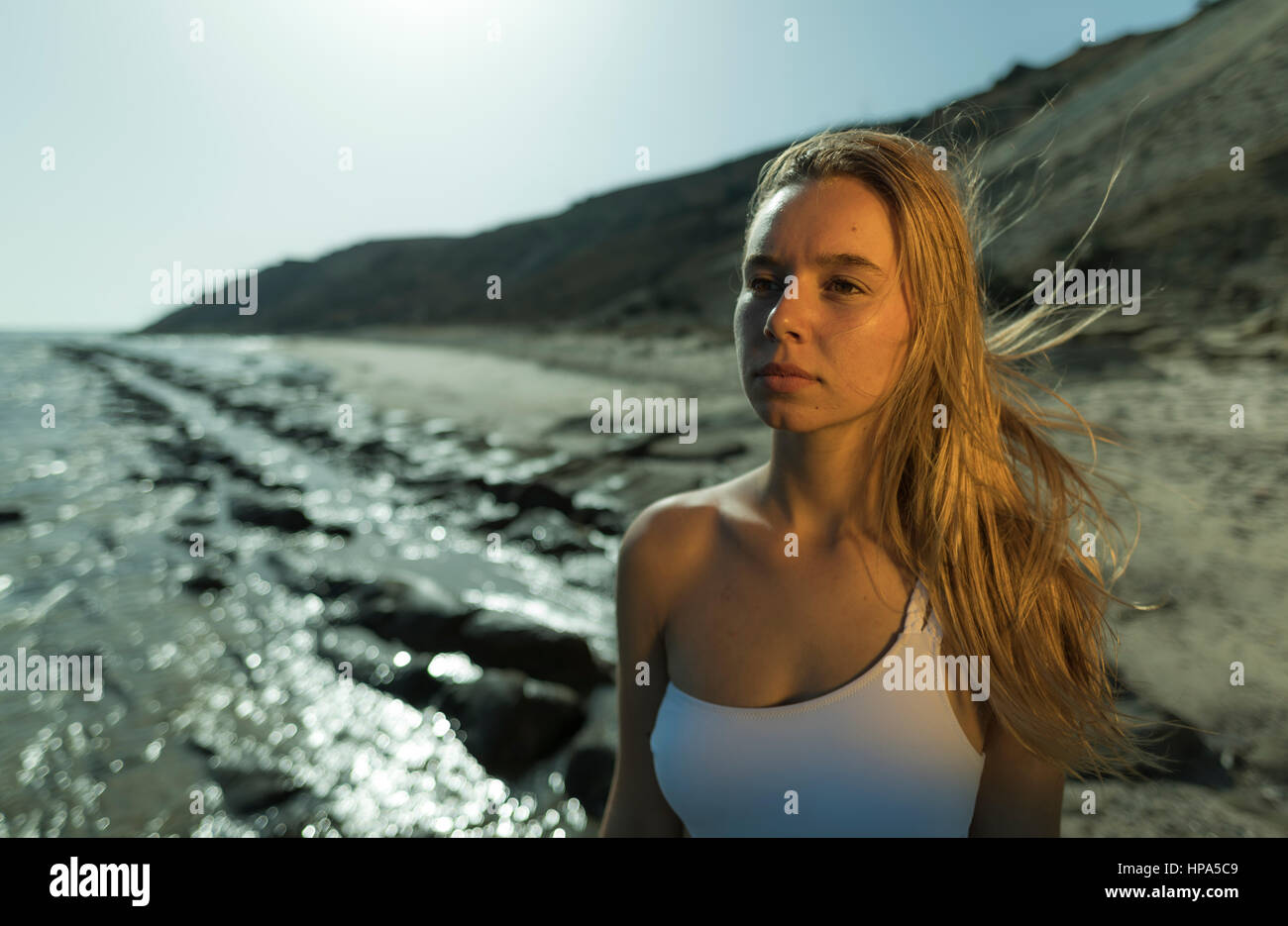 Young woman at the beach. Stock Photo