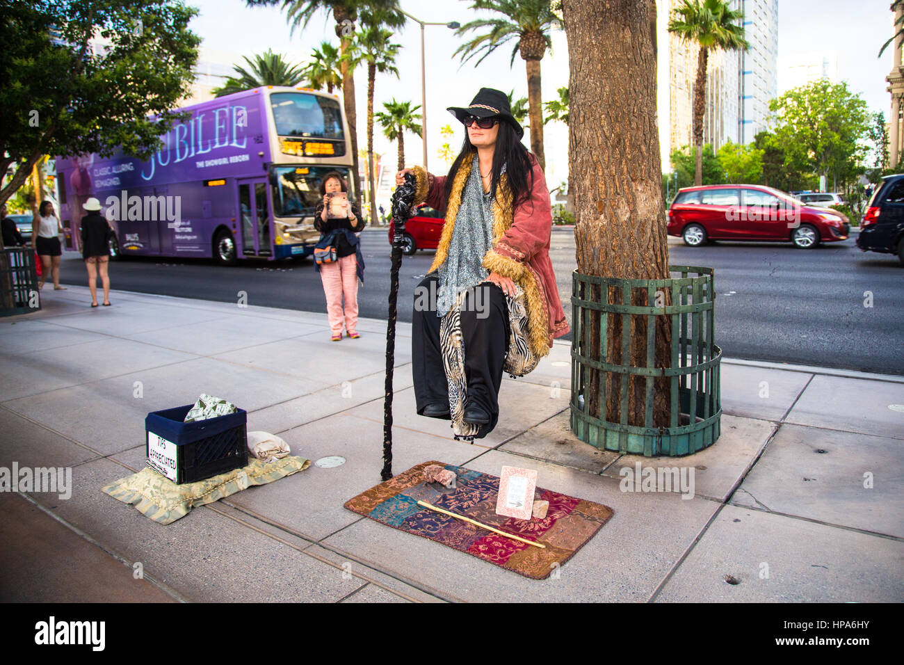 LAS VEGAS, NEVADA - MAY 7, 2014: View of Street performer doing levitation act along Las Vegas Boulevard. Stock Photo