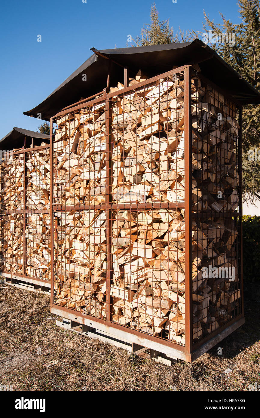 Chipped fire wood in packing on pallets Stock Photo