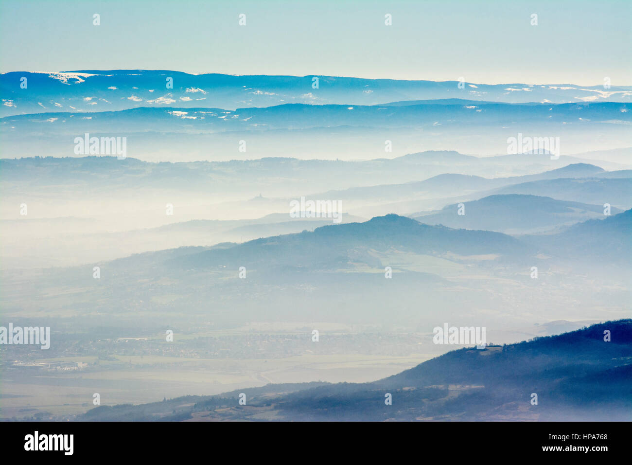 Mist in mountain valleys at dawn Stock Photo