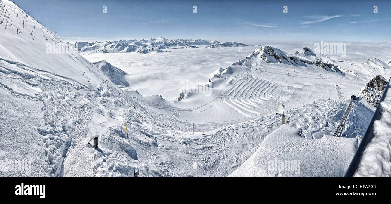 Ski resort in the Alps. Ski slopes, piste, powder snow in the mountains ...