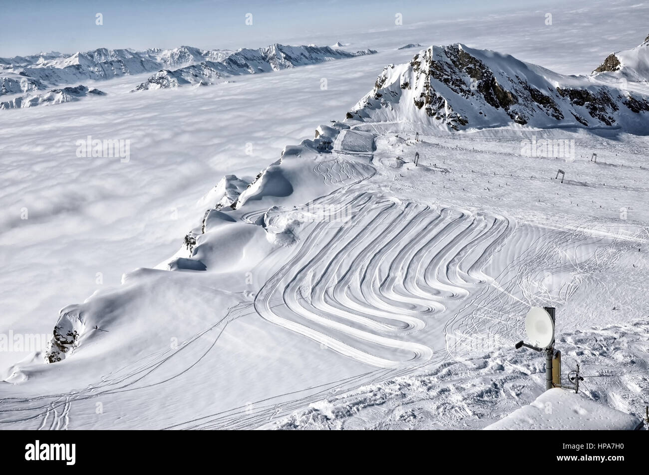 Ski resort in the Alps. Ski slopes, piste, powder snow in the mountains ...