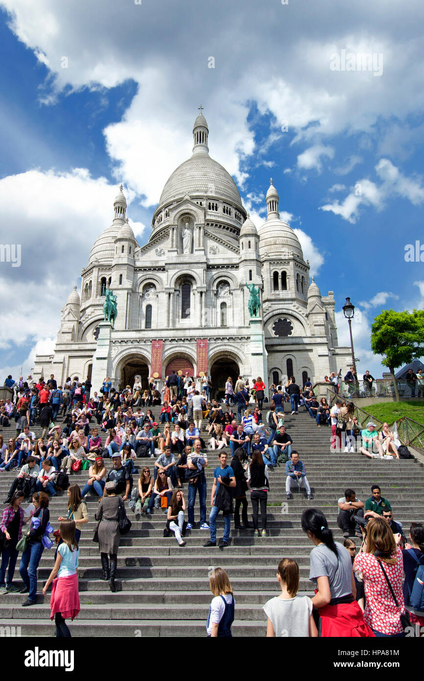 Sacre Coeur Basilica, Montmartre, Paris, France with tourists on the