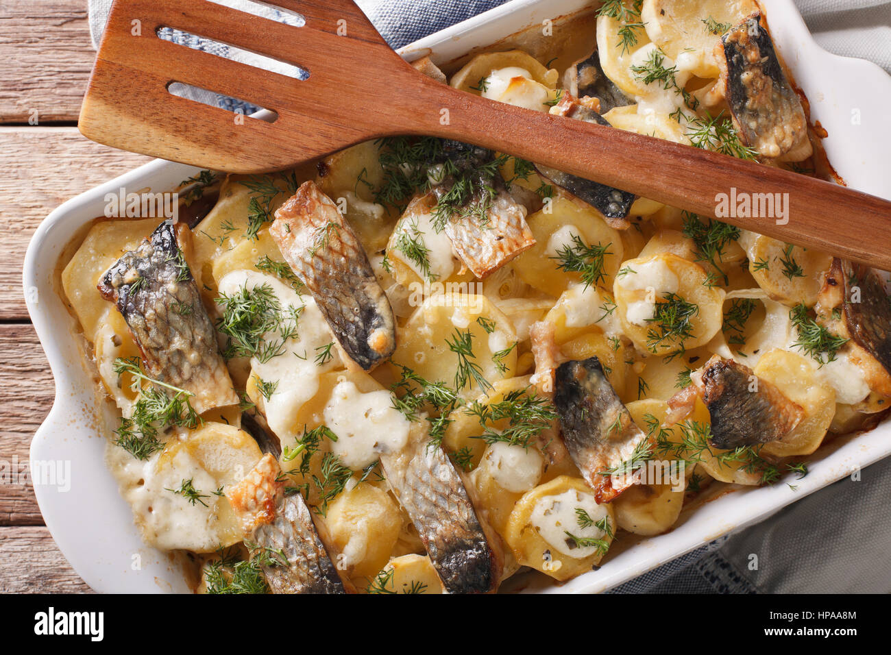 Finnish Food: Casserole made from potatoes and herring close up in