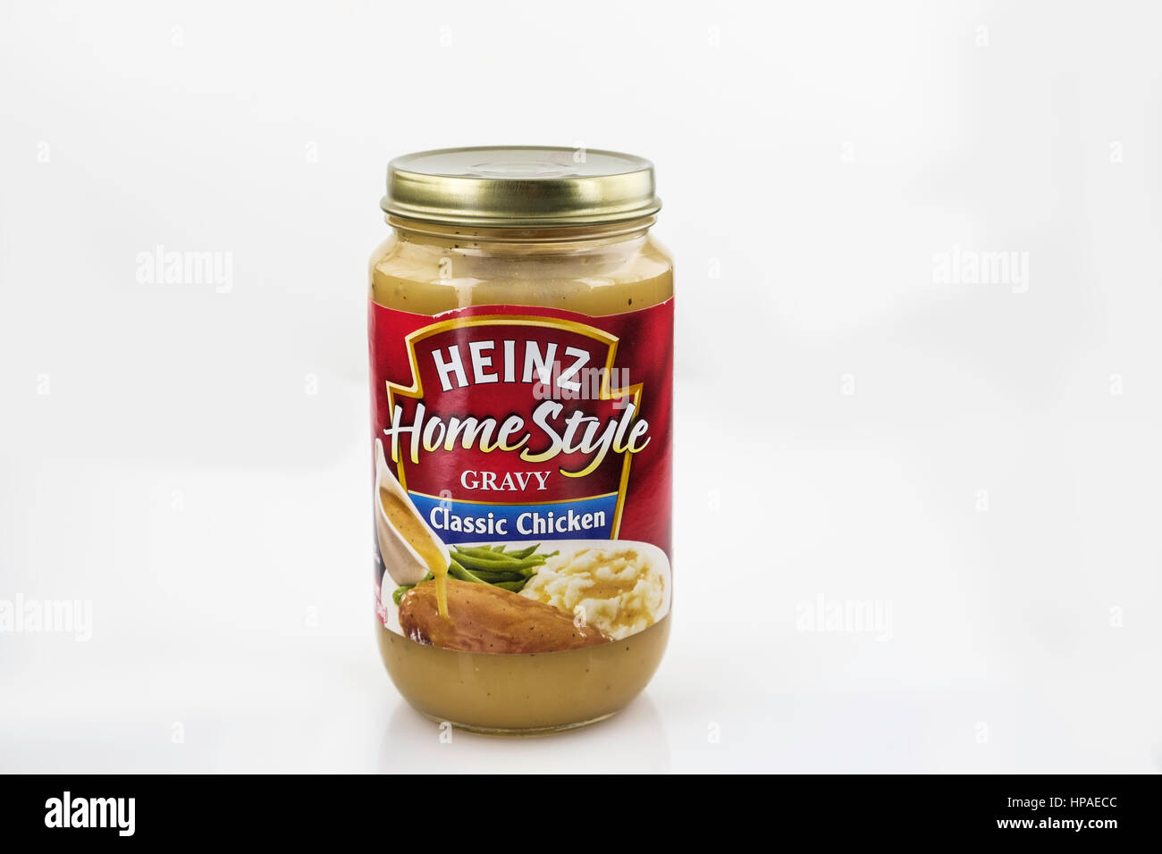 A jar of Heinz brand Home Style gravy, chicken flavored. cutout, copyspace. USA. Stock Photo