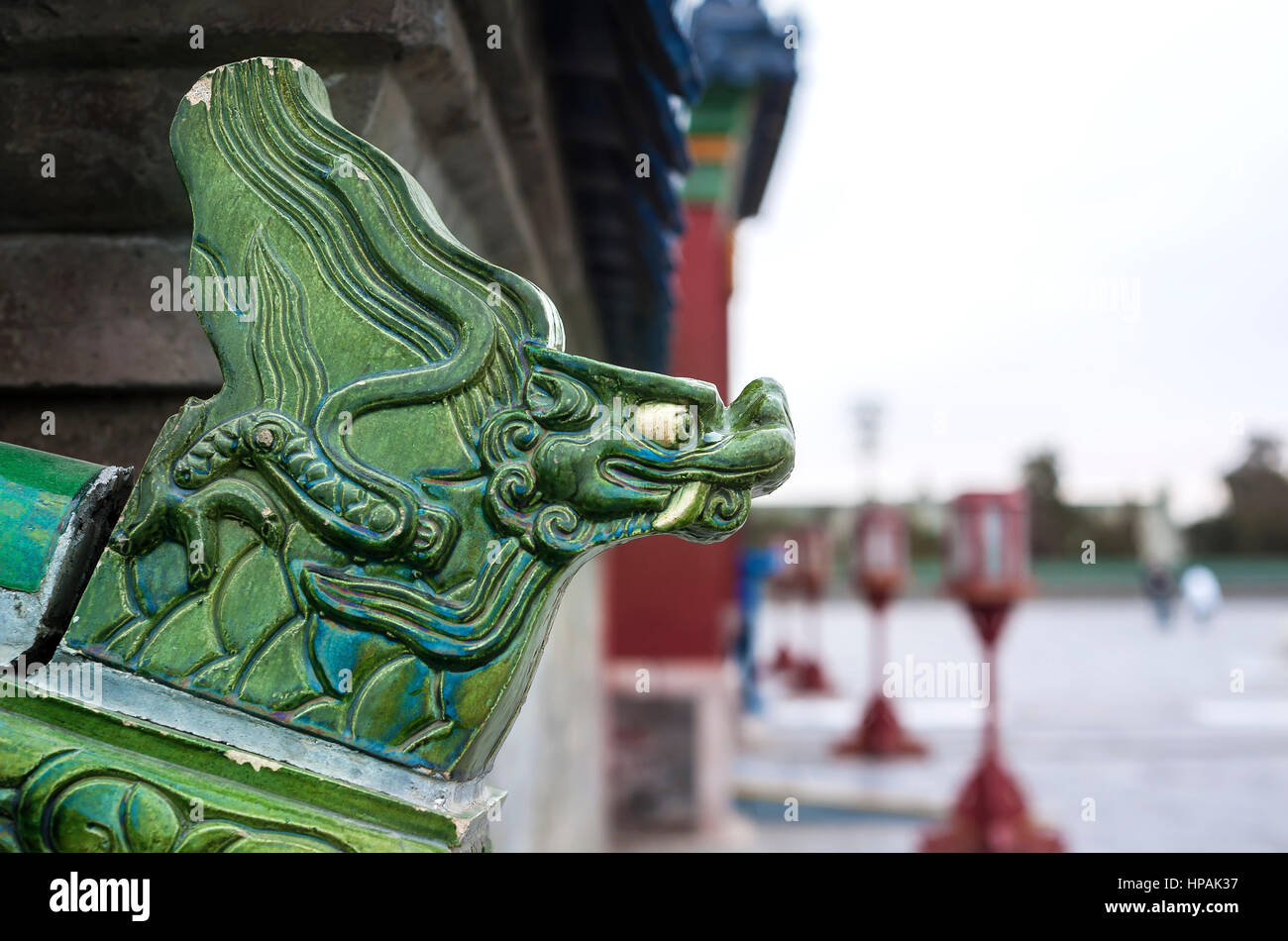 Green ceramic dragon head on an exterior wall at the Temple of Heaven, Beijing Stock Photo