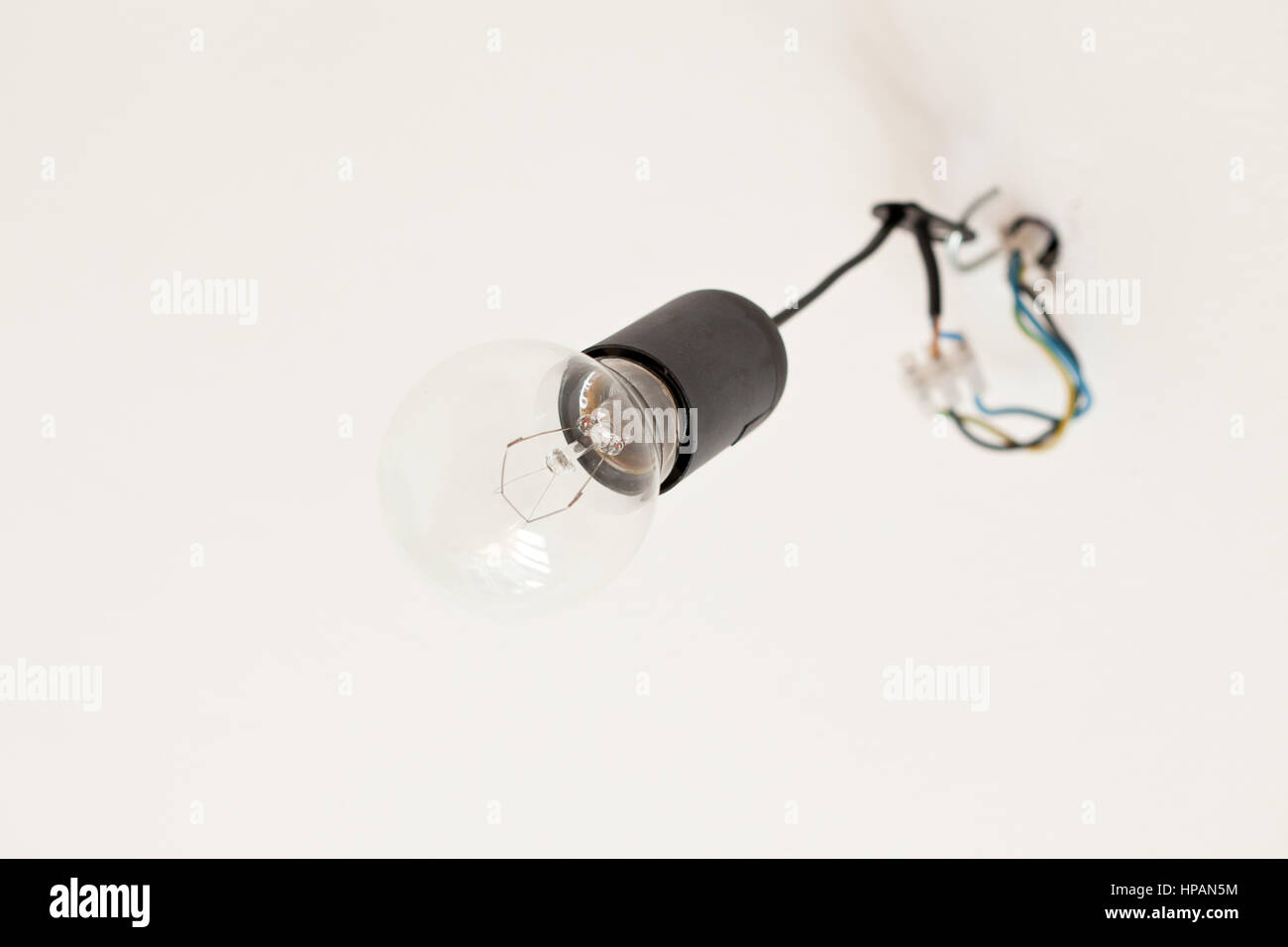 Old light bulb hanging on a ceiling Stock Photo Alamy