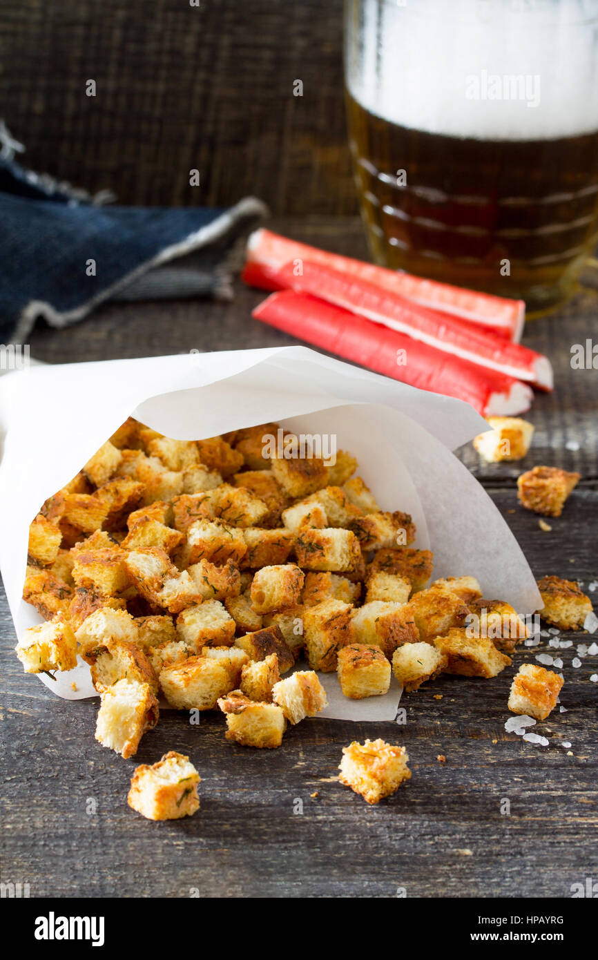 Snack food. Crab crackers, dried white bread and crab sticks and tomato