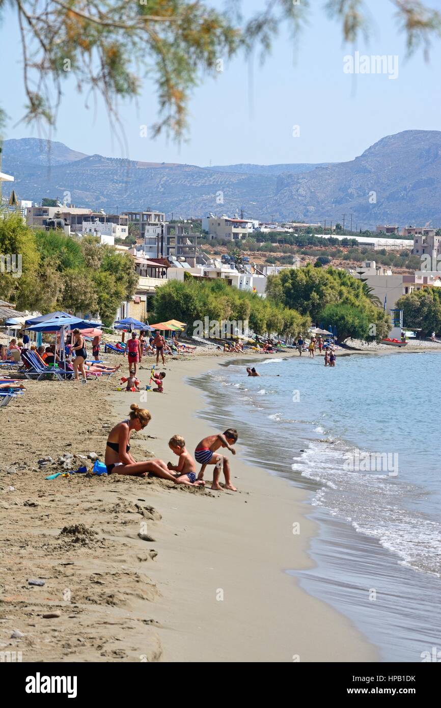 Tourists relaxing on the beach, Makrigialos, Crete, Greece, Europe. Stock Photo