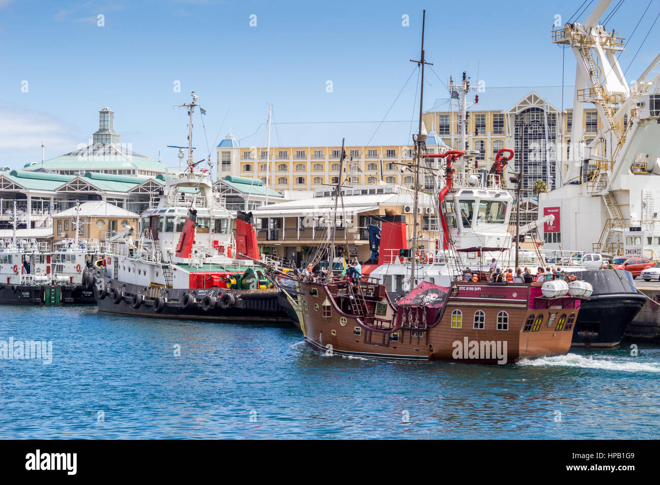 CAPE TOWN, SOUTH AFRICA - DECEMBER 19, 2016: Photo of The Jolly Roger Pirate ship entering the Victoria and Alfred Waterfront harbour in Cape Town dur Stock Photo