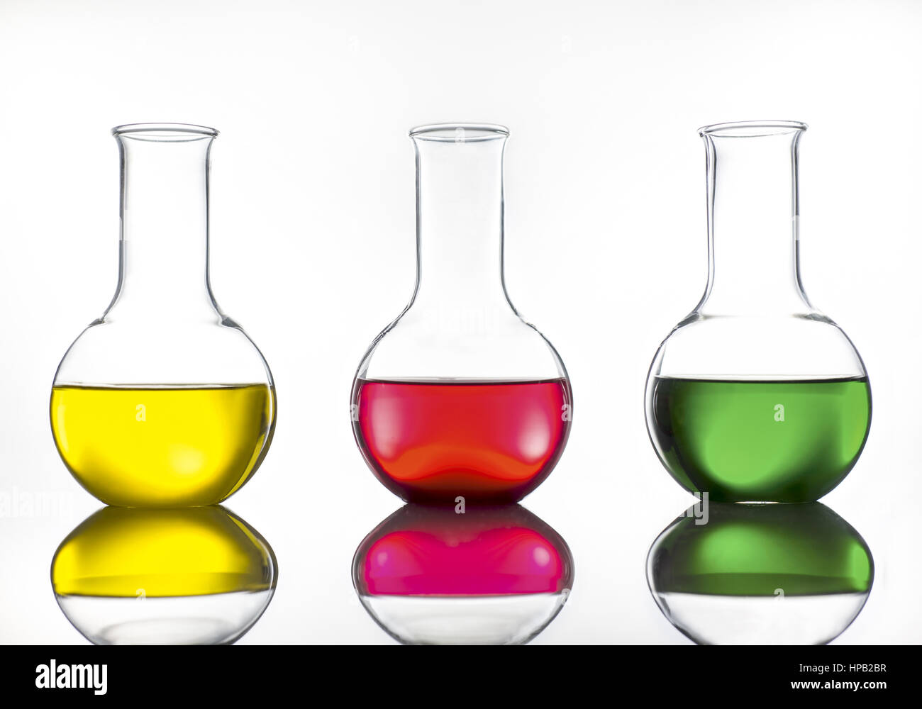 Laborgefaesse aus Glas mit farbigen Fluessigkeiten Stock Photo