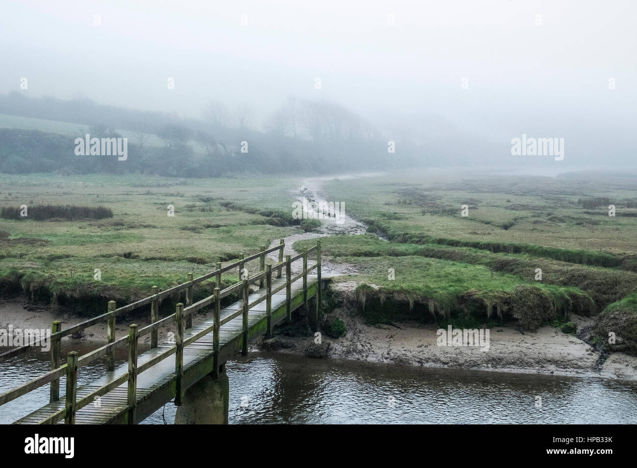 UK weather Misty day Gannel River Footbridge Gannel Estuary Newquay Cornwall Stock Photo