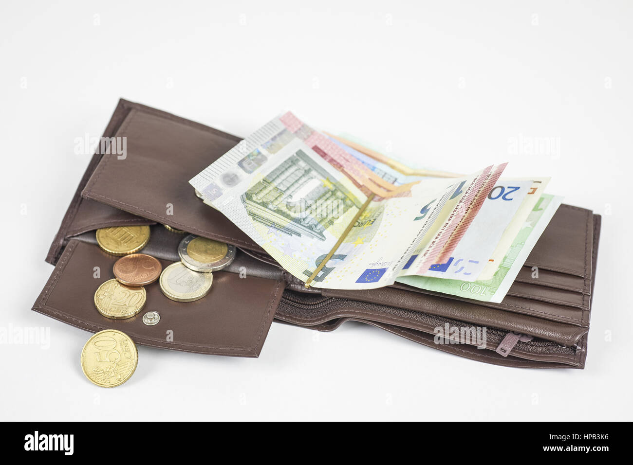 Braune Geldboerse mit Euro Geldscheinen und Muenzen Stock Photo