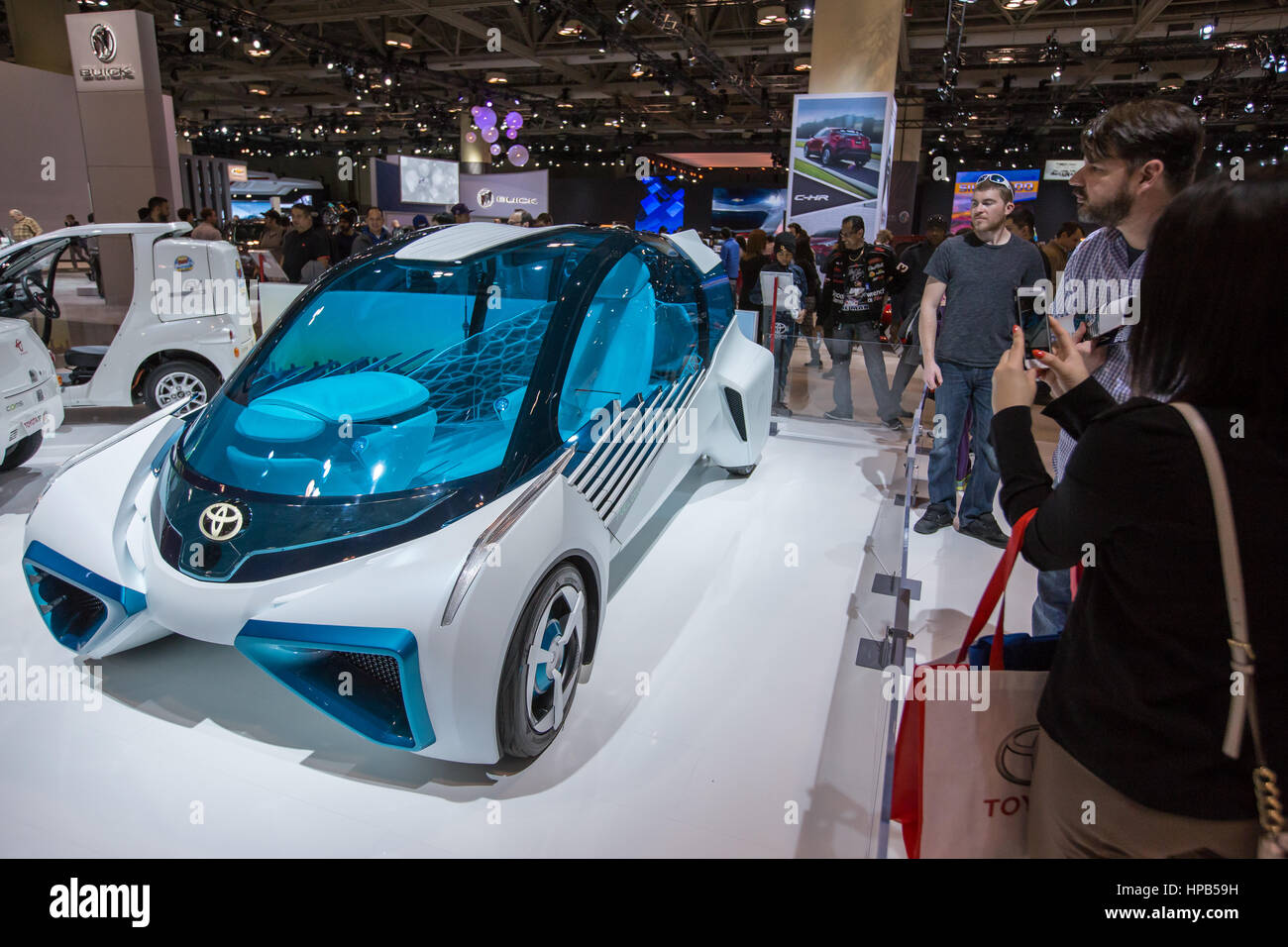 People checking out Toyota self driving car FCV Plus at the auto show in Toronto Ontario Canada Stock Photo