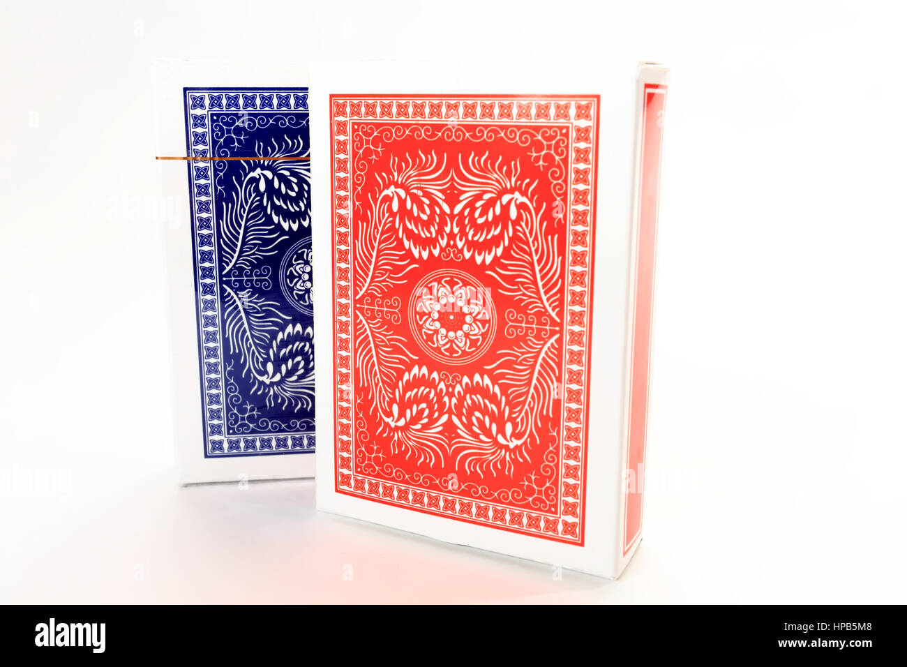 Red and blue card decks isolated on white background. Poker cards close up. Stock Photo
