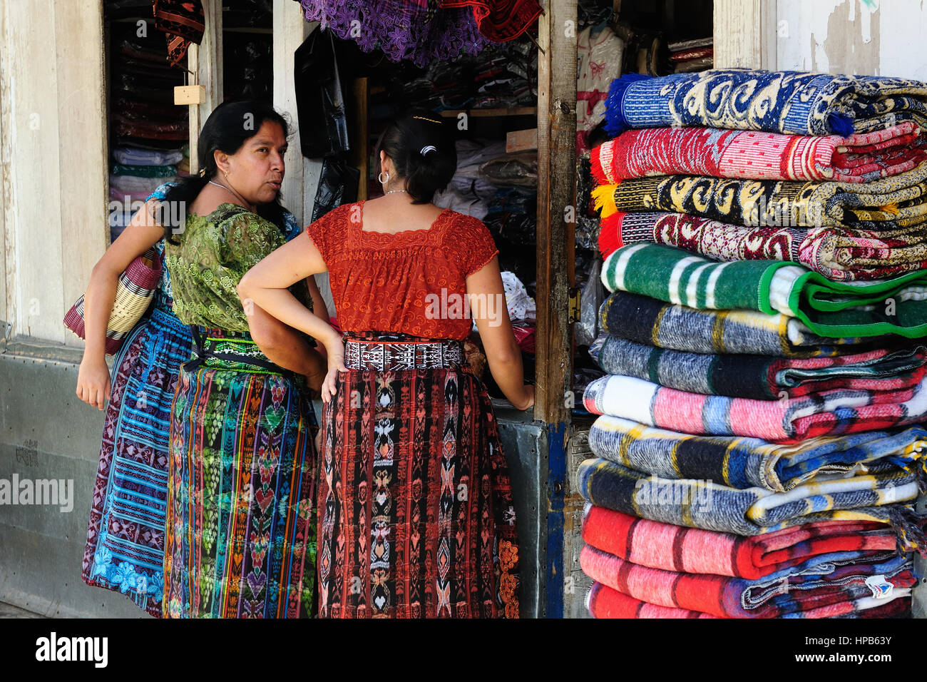 SAN PEDRO LA LAGUNA, GUATEMALA - JANUARY 20: Ethnic women from Guatemala are doing the shopping of colour materials in order to make new dresses for o Stock Photo