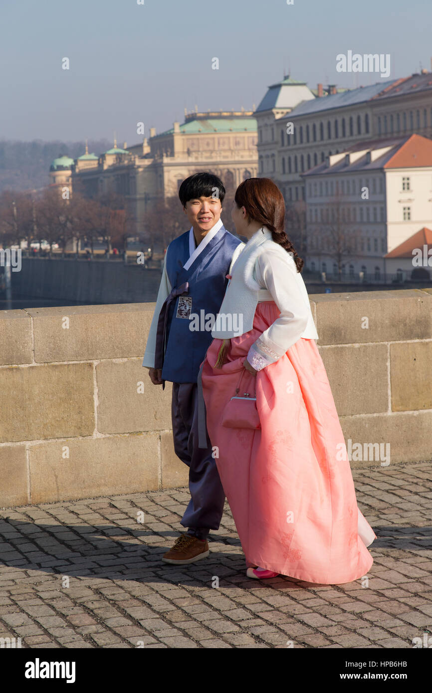South Korean couple in traditional dress on Charles Bridge in Prague Czech Republic Stock Photo