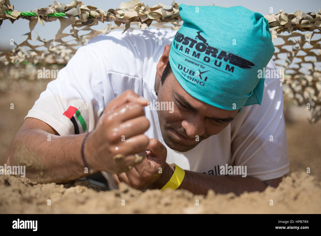 Dubai, UAE - Feb 10th, 2017: Participating in the SandstormDXB race: an off-track obstacle running competition. Stock Photo