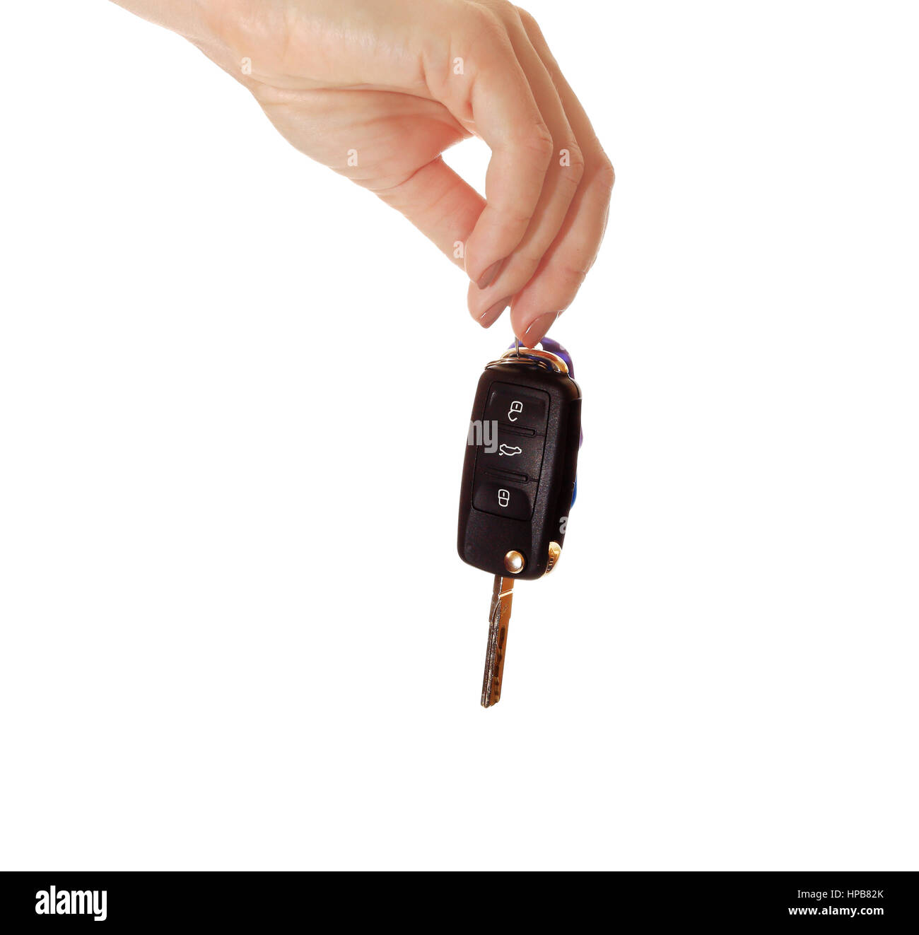 Car key in hand isolated on white background. Black ignition key close