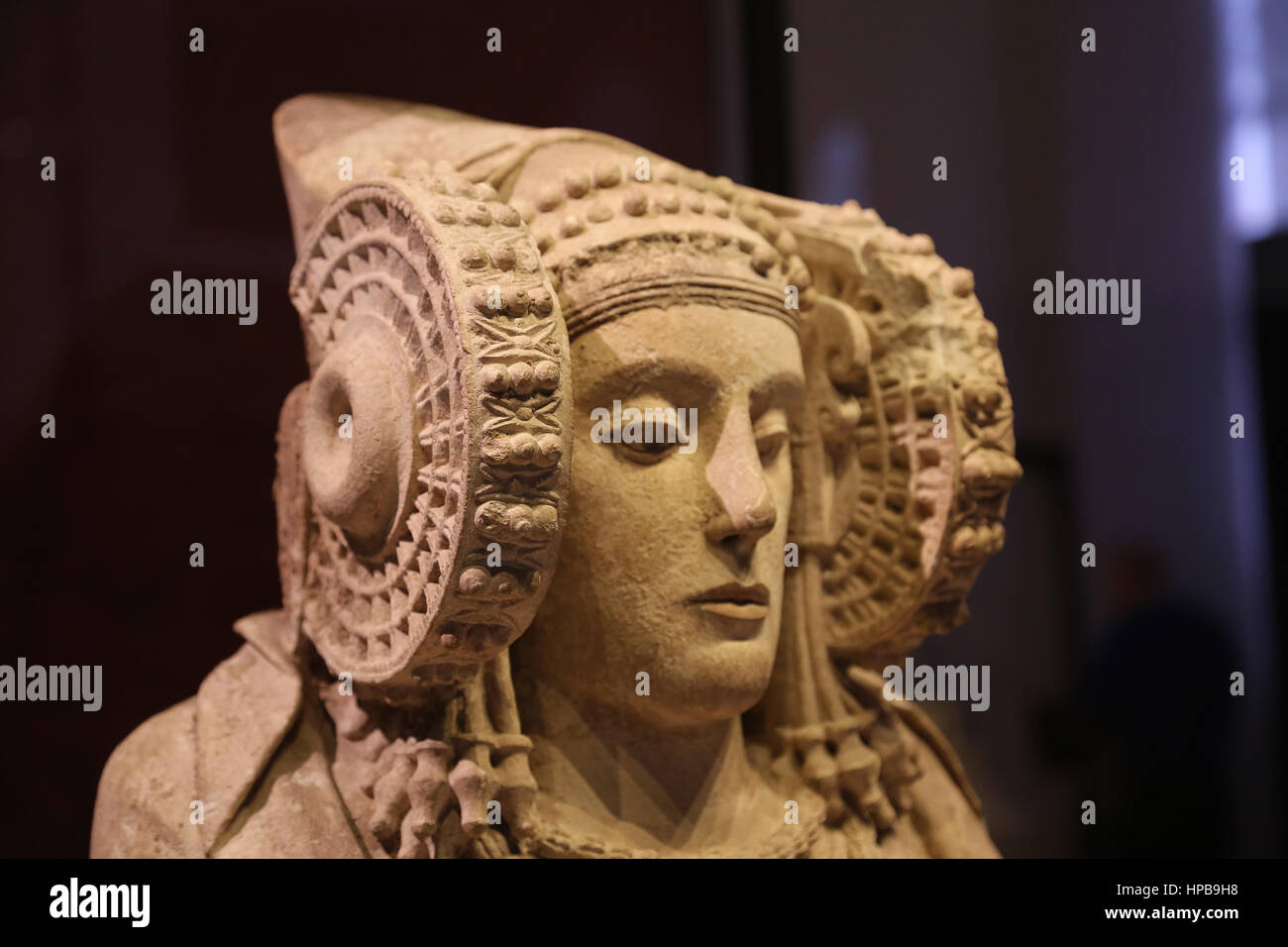 Lady of Elche. Funerary urn. 4th century BC. From l'Alcudia. Iberian sculpture. Woman wearing a complex headdress and large wheel-like coils. Stock Photo