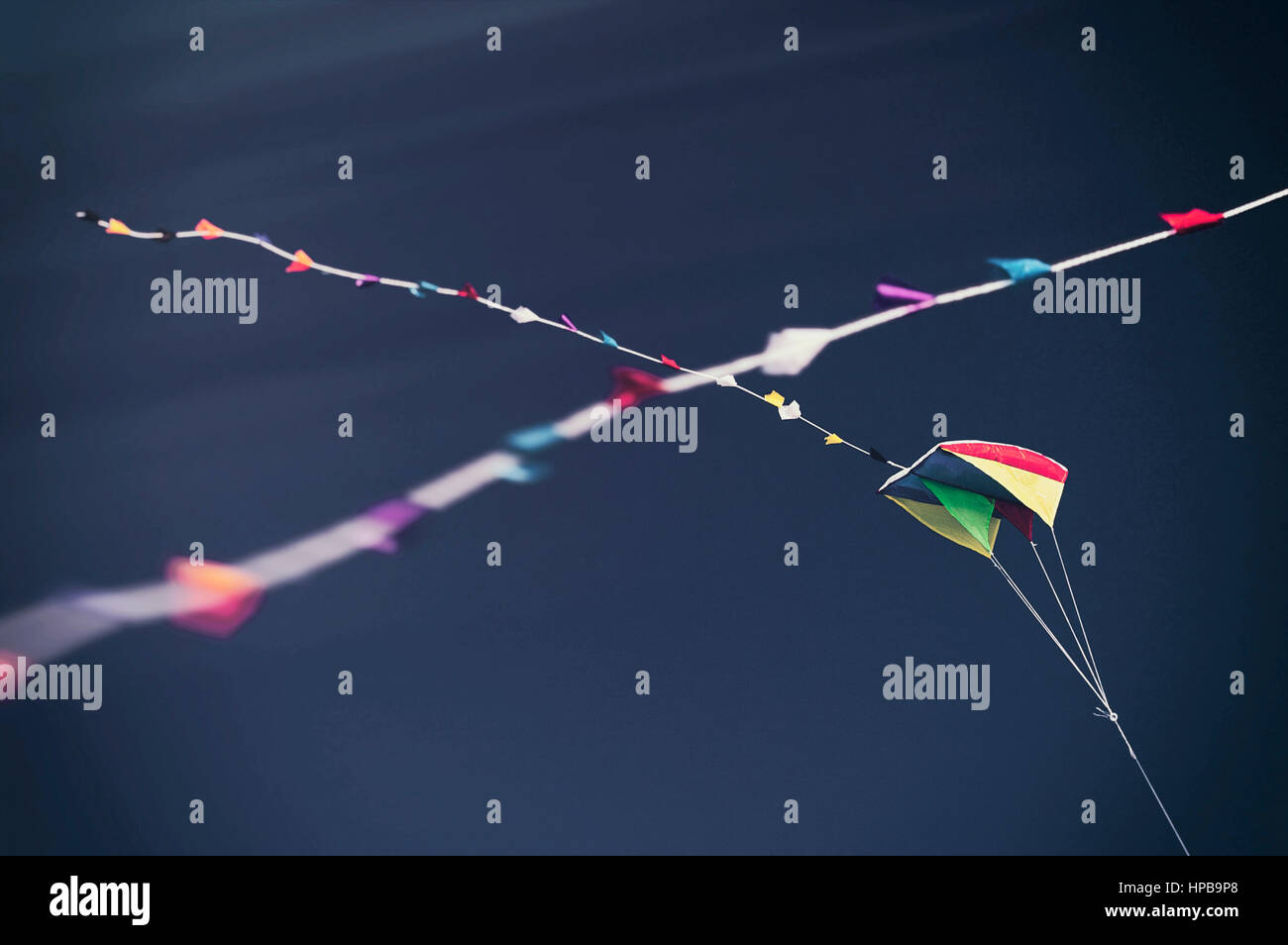 Kites with long tails in a vintage toned blue sky Stock Photo Alamy