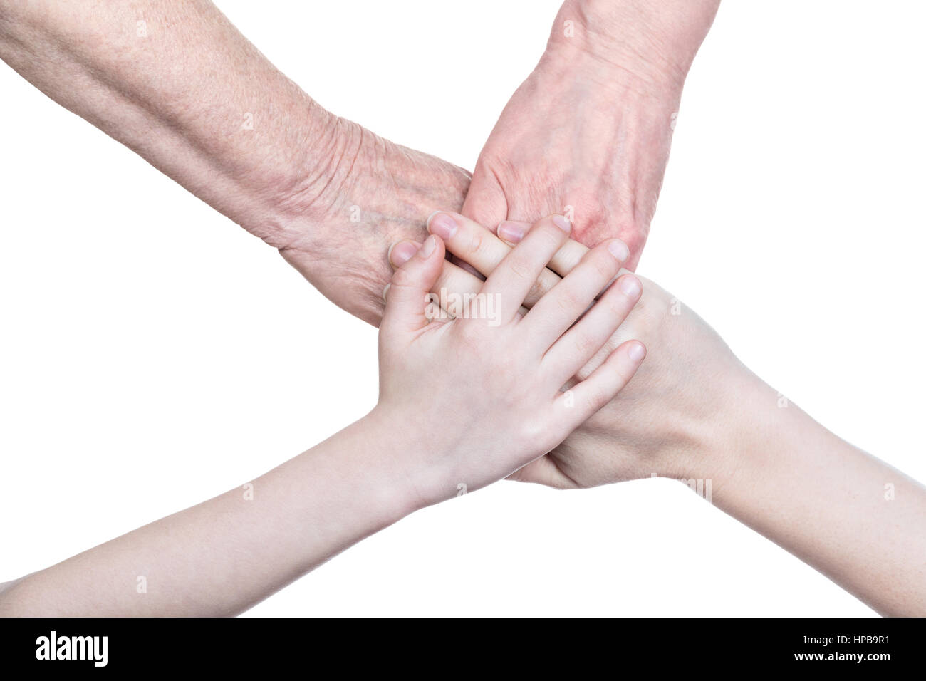 Four people touching hands hi-res stock photography and images - Alamy