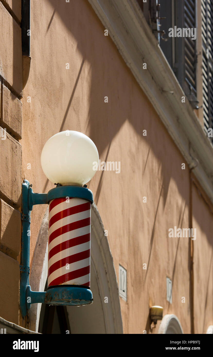 A barber shop sign in Rome, Italy, Europe Stock Photo