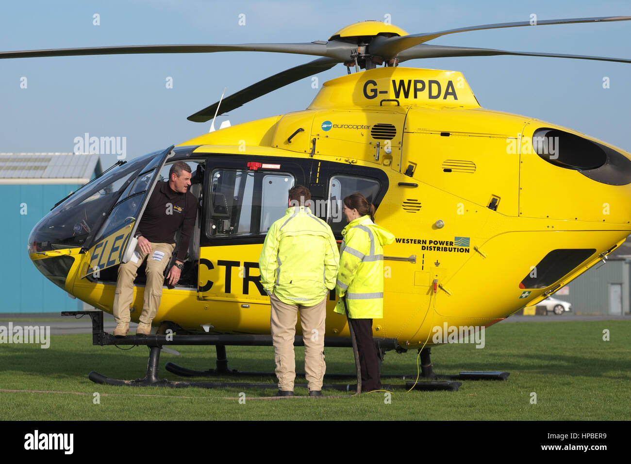 Eurocopter EC 135 helicopter used for electricity power supply  checking by Western Power Distribution WPD in UK being refueled Stock Photo