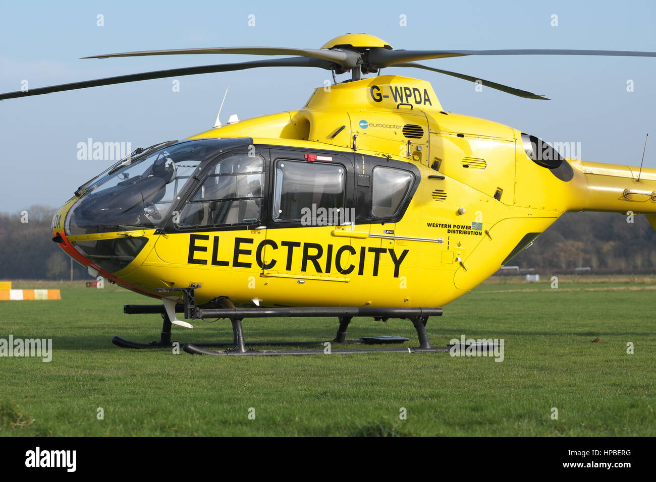 Eurocopter EC 135 helicopter used for electricity power supply checking by Western Power Distribution WPD in UK Stock Photo