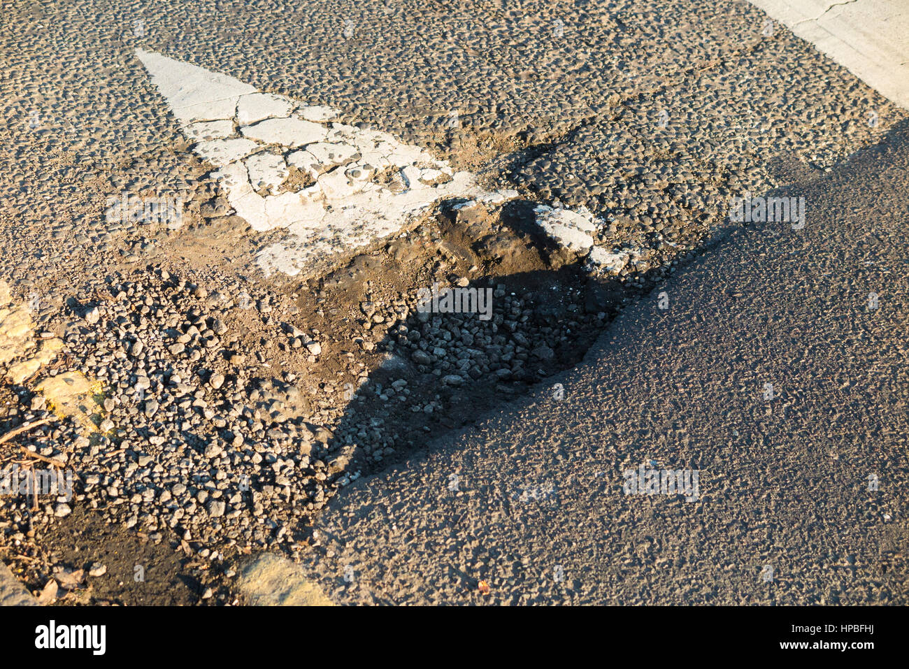 Pot hole / Pothole / holes / potholes where the road / street has a