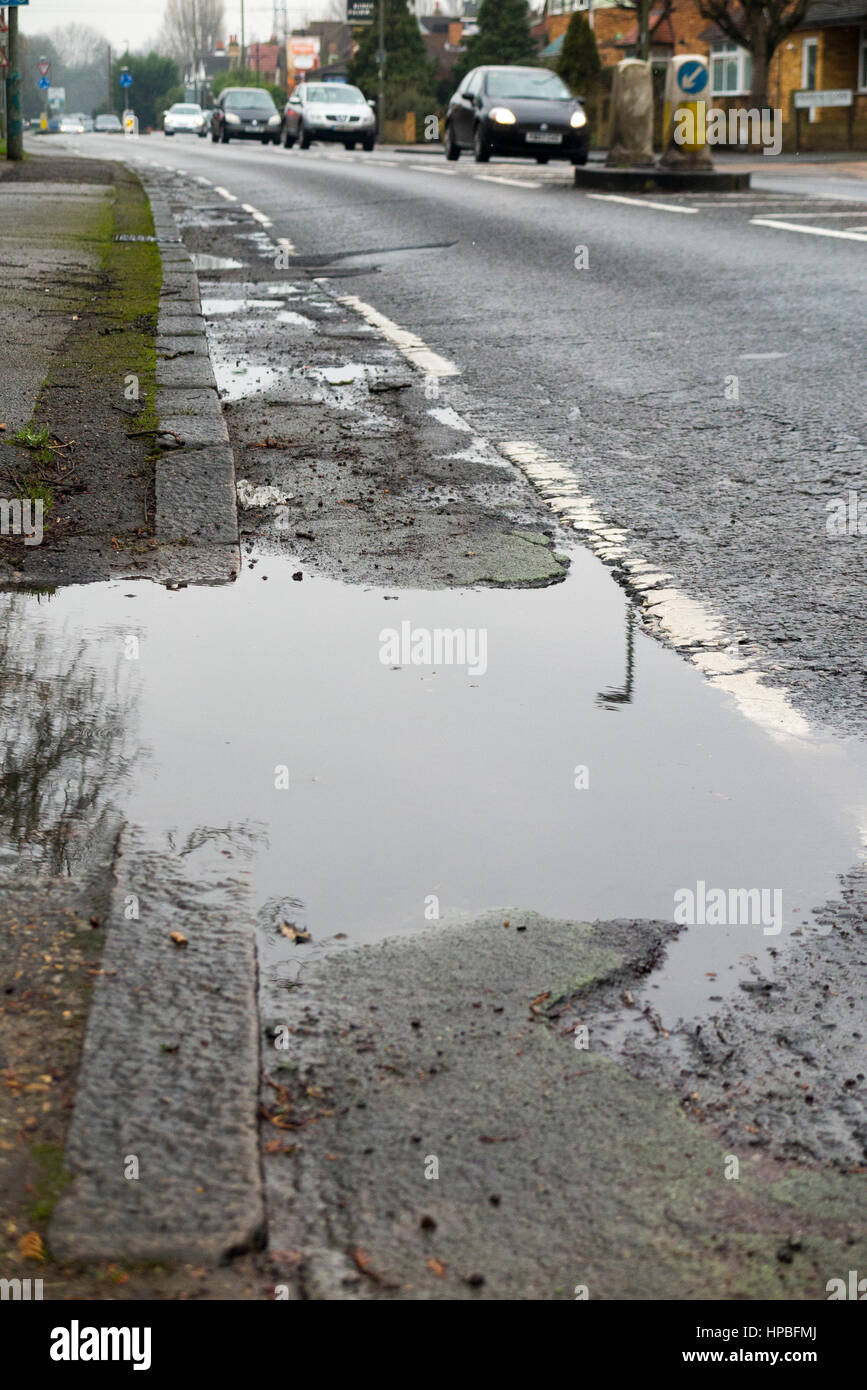 Poor quality broken bicycle / bike / cycle lane / lanes with a cracked