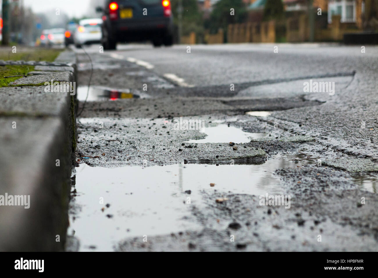 Poor quality broken bicycle / bike / cycle lane / lanes with a cracked